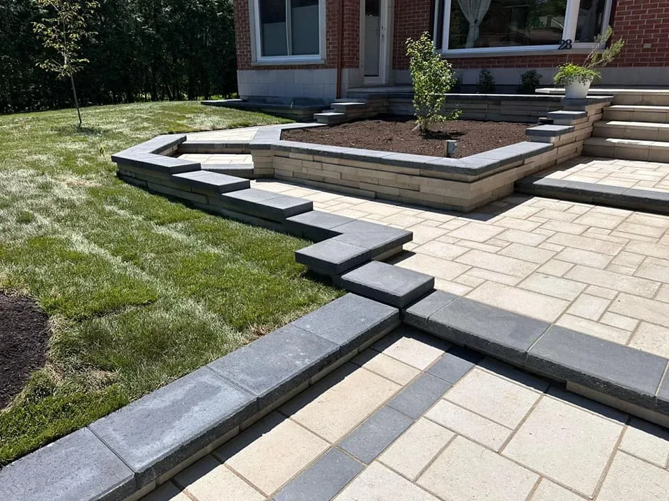 Front garden with tiered paving and planting beds
