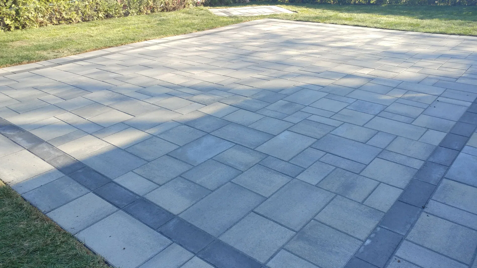 Rectangular grey pavers with a contrasting border